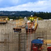 A construction site with rebar being used to create concrete walls.