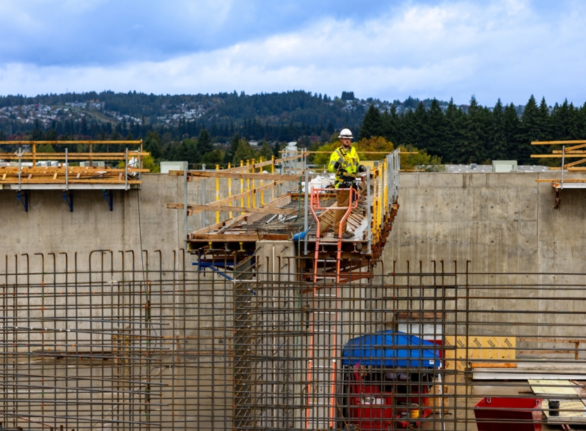 A construction site with rebar being used to create concrete walls.