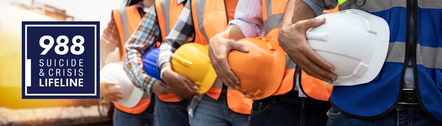 Construction workers standing in a line holding hard hats with 988 Suicide & Crisis Lifeline logo.