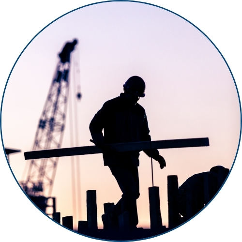 Construction worker on rooftop.