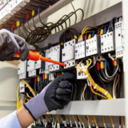 Commercial electric panel with multicolored wires.
