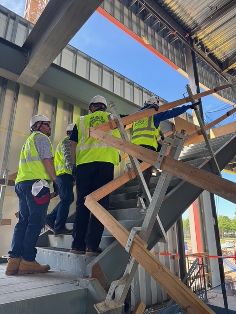 OEG electrical contractors climbing the stairs at the new Hillsboro Hops ballpark.
