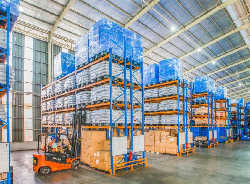 Large warehouse with boxes stacked to the ceiling.