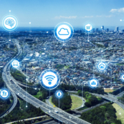 Aerial image of large metropolitan area with highways, skyscrapers, and residential areas.