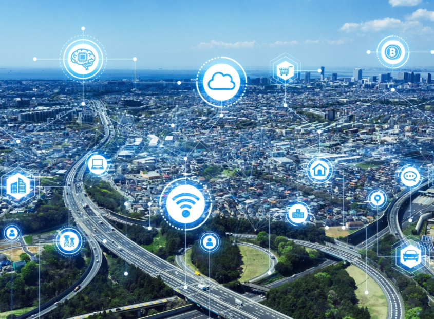 Aerial image of large metropolitan area with highways, skyscrapers, and residential areas.