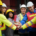 Team of construction workers putting their hands together for a team cheer.